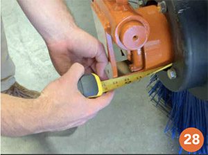 Photo shows tape measure being used to verify that the brush is 13" on and makes a good fit.